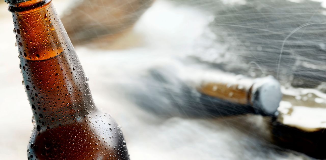 beer bottles cooling off in a stream