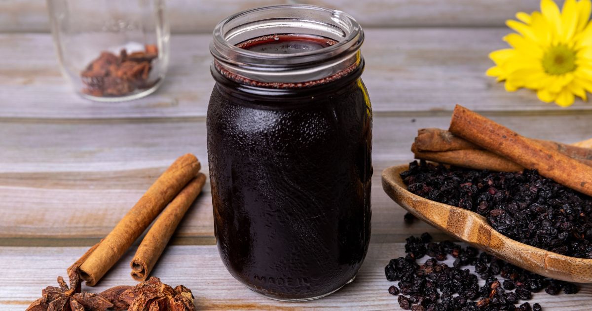 mason jar filled with elderberry syrup