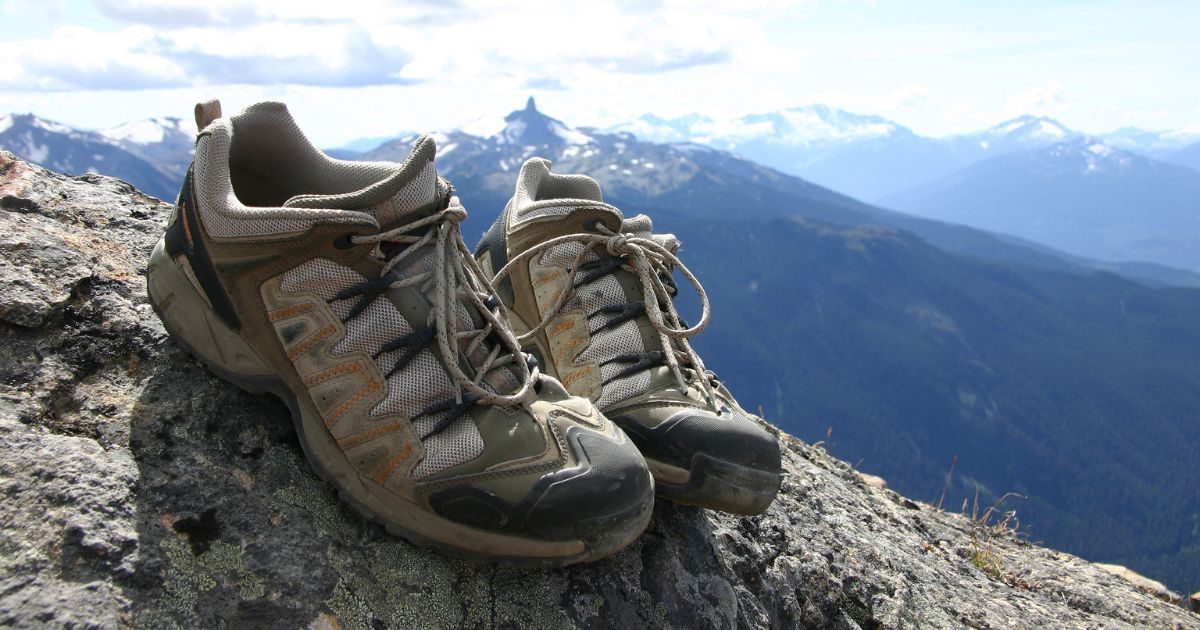 hiking shoes with mountain backdrop