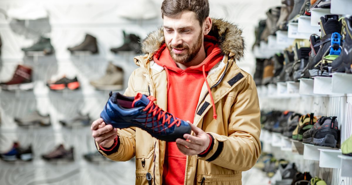 man shopping for hiking shoes