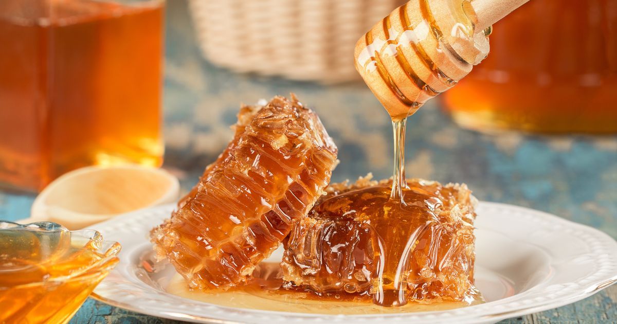 honeycomb and honey dripping on top of it