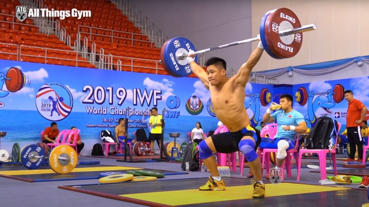 weightlifter performing a power snatch
