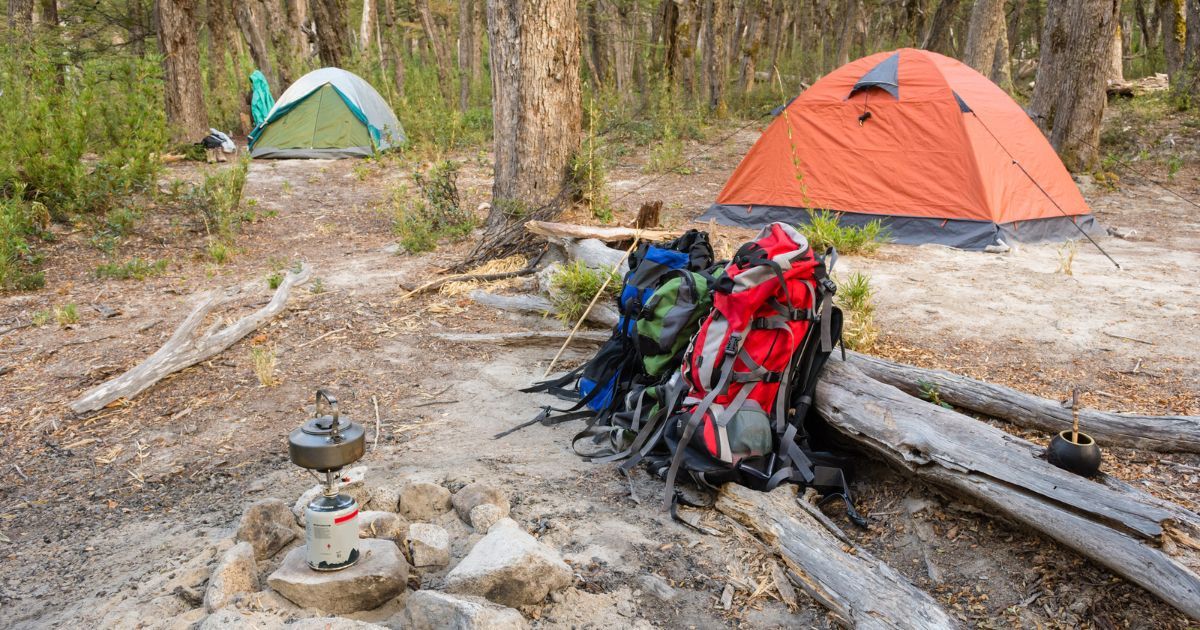 backpack and tents setup at a backcountry camp site