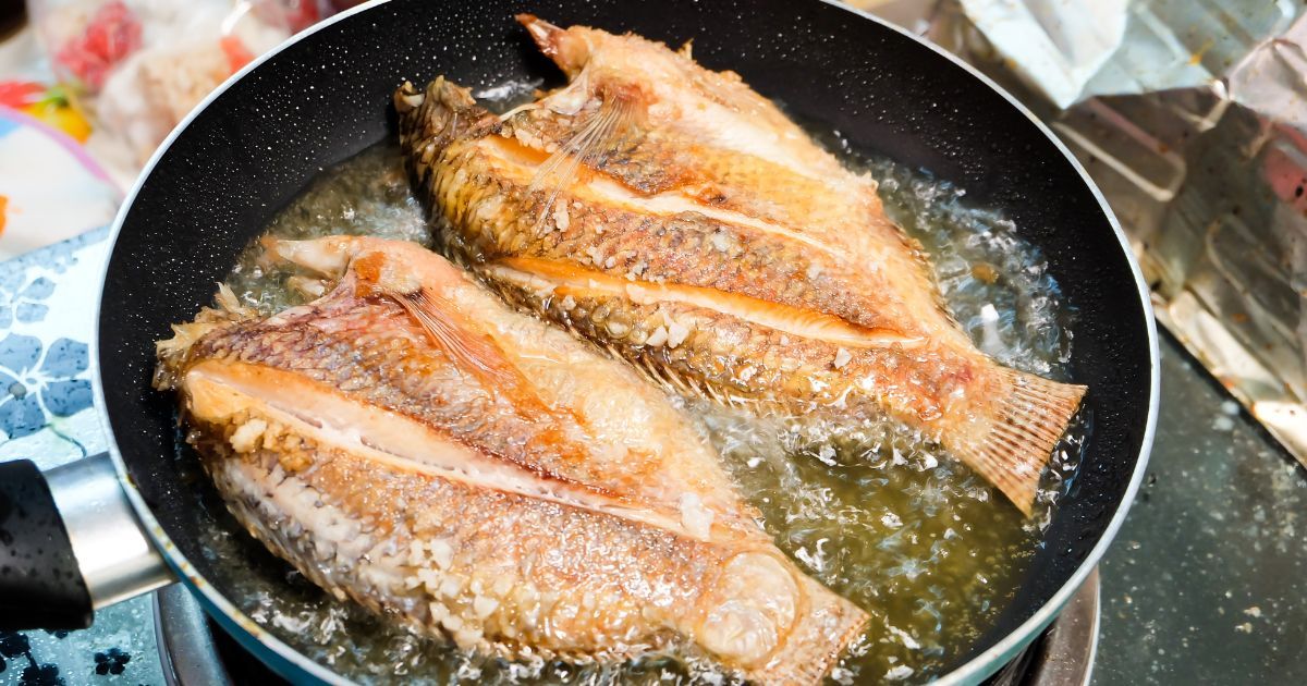frying fish in pan
