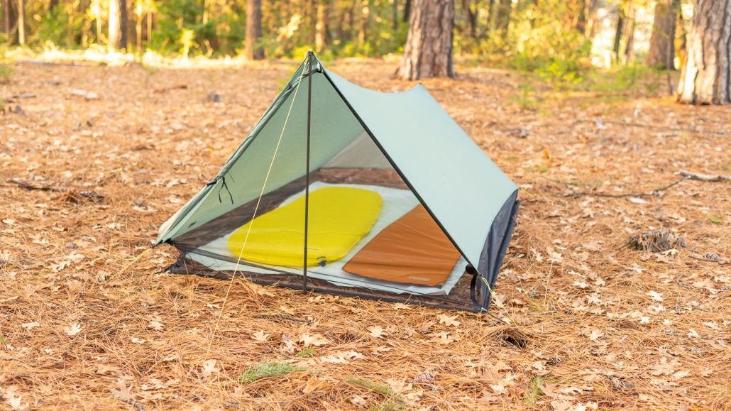 tarp tent setup with sleeping pads