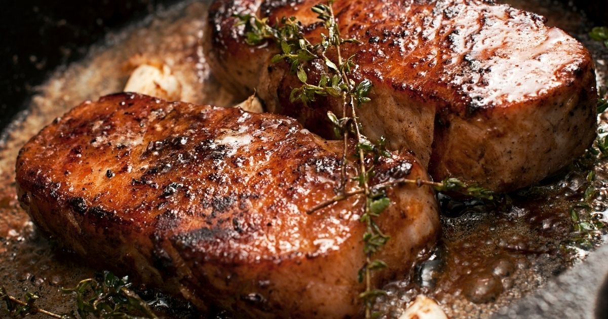 searing pork steaks in pan