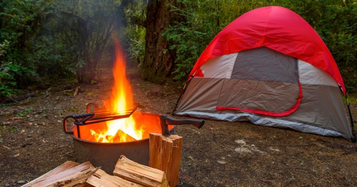 tent setup by a fire