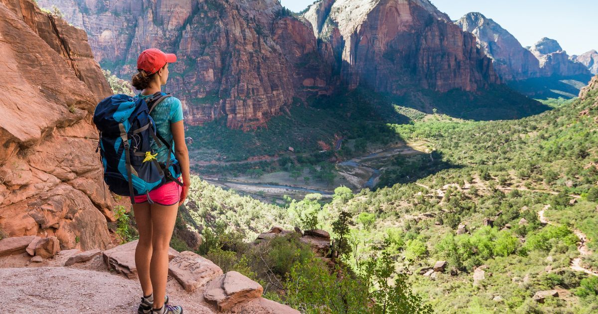 woman backpacker overlooking valley