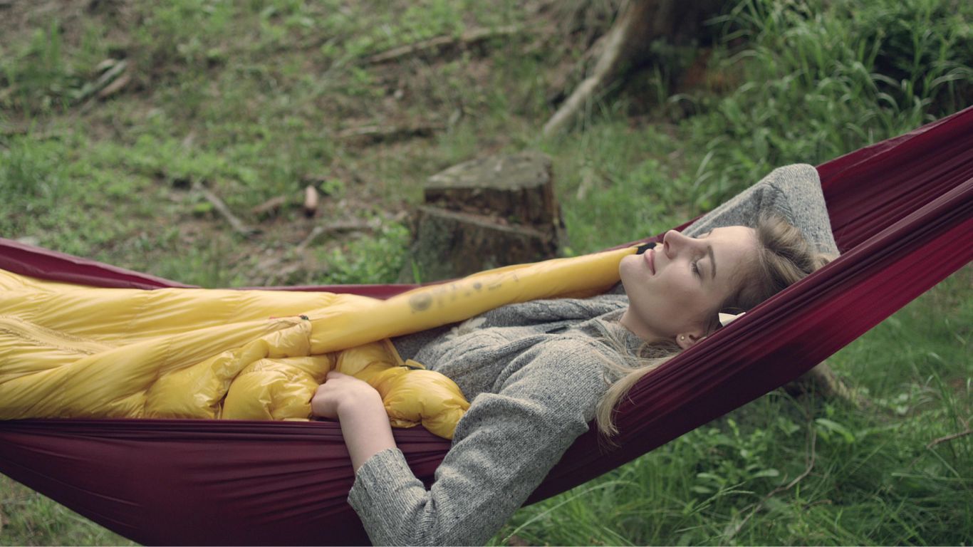 woman sleeping in hammock