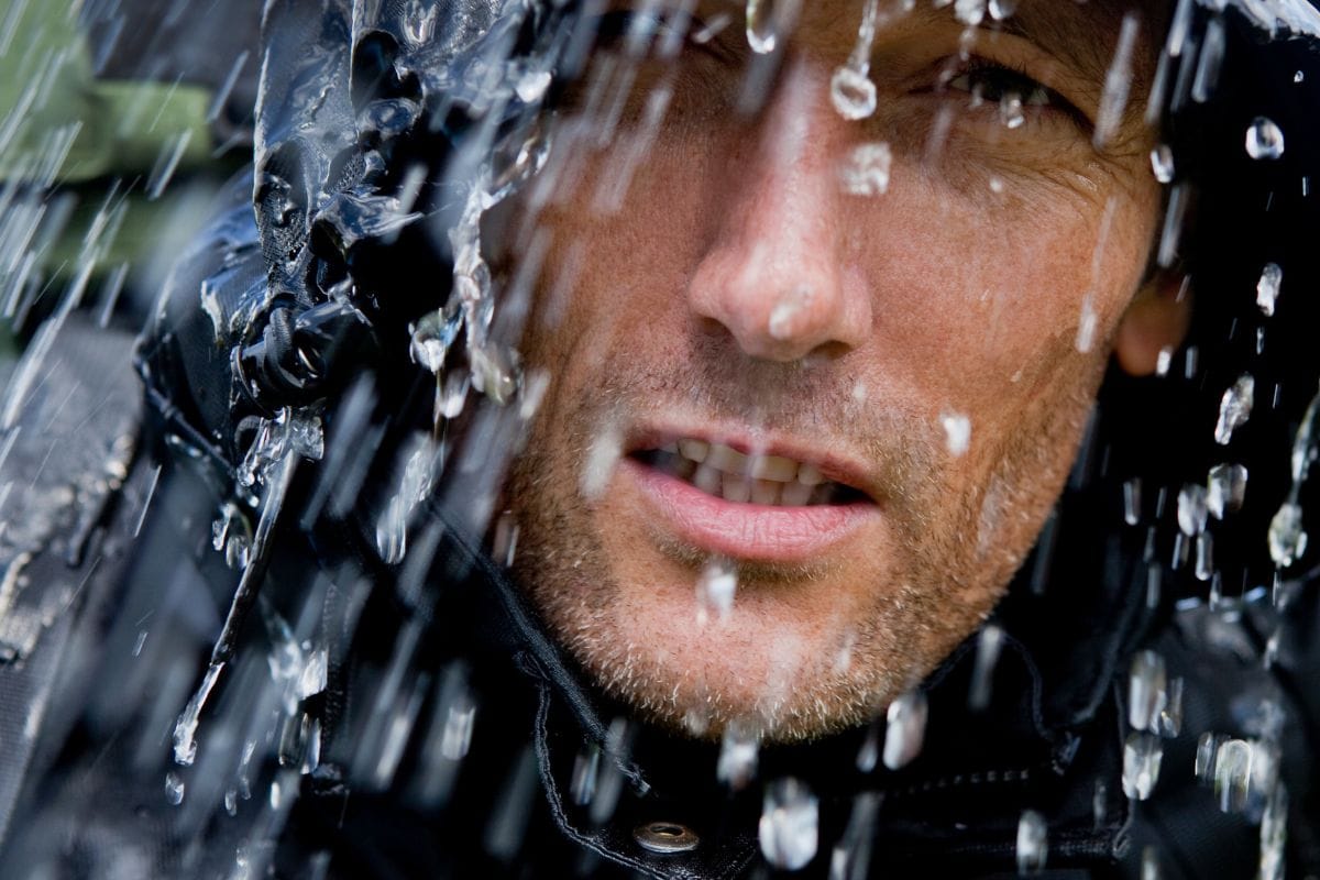 close up man's face in heavy downpour