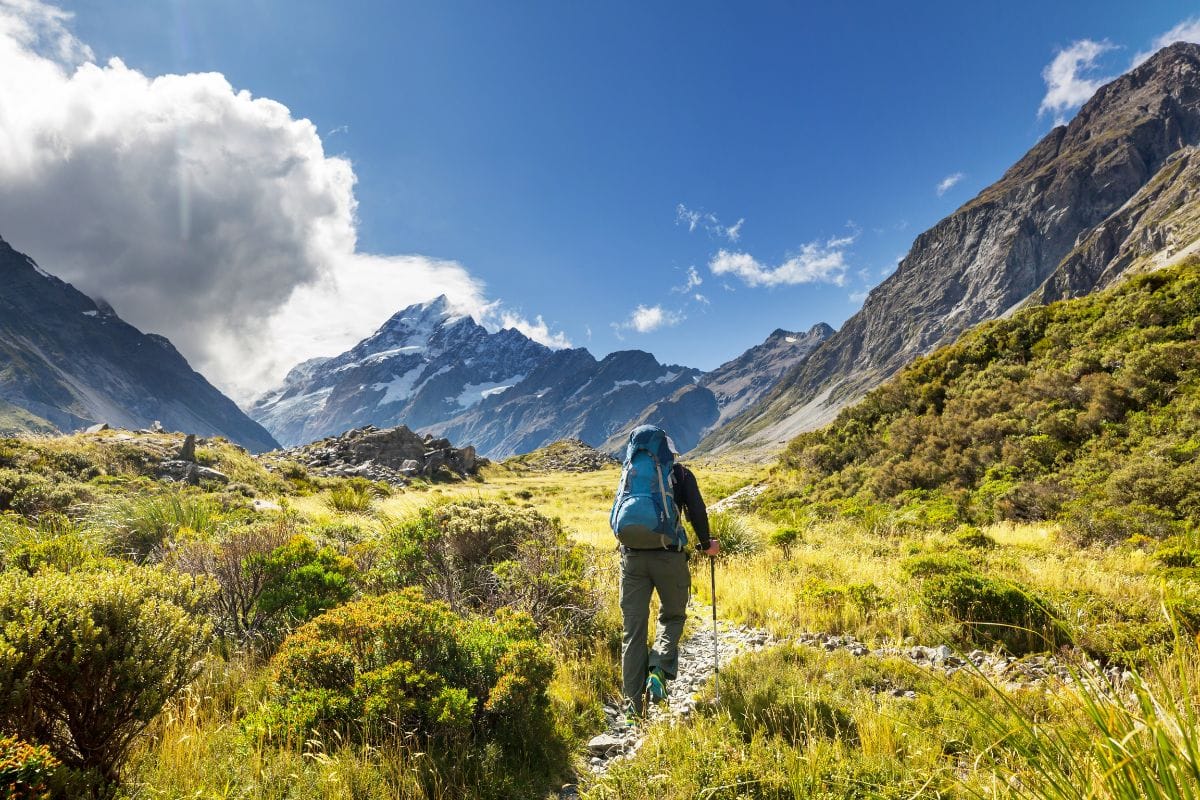 man hiking at Mount Cook, New Zealand